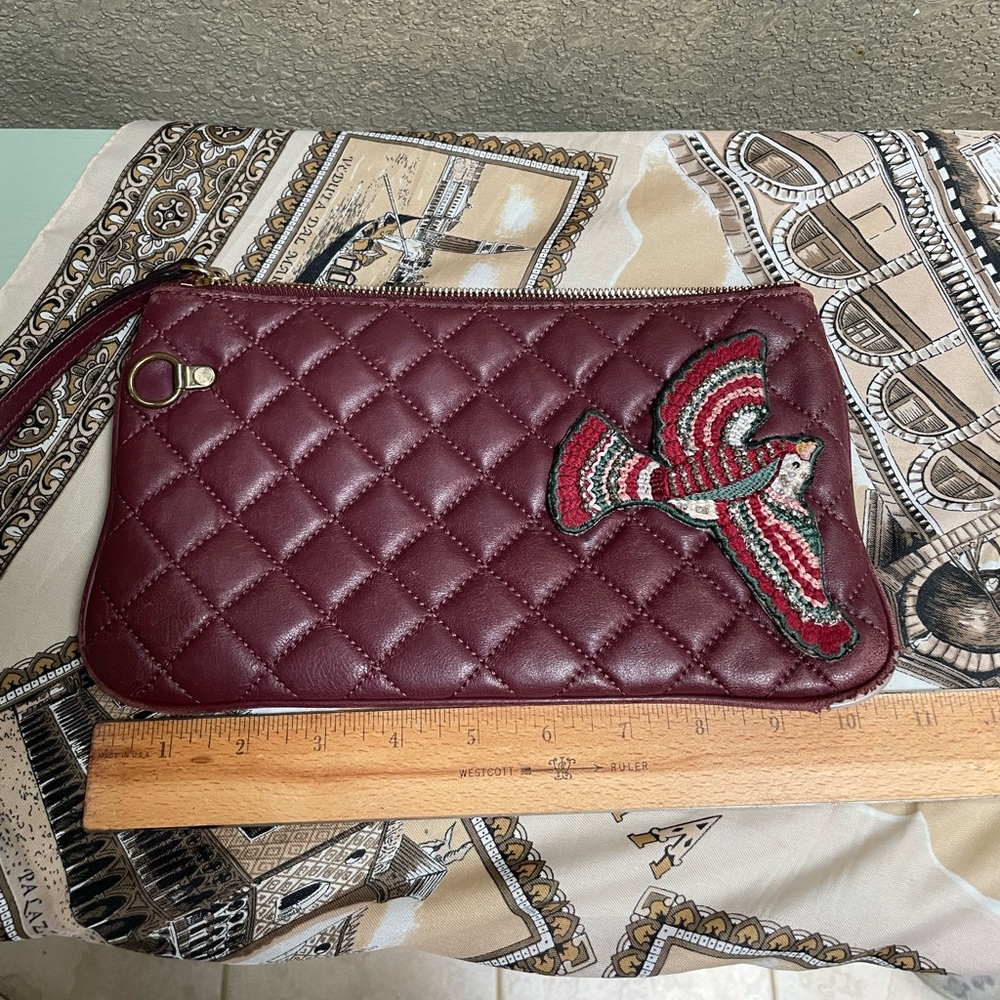 Michael Kors Soft, leather clutch, quilted, embellished burgundy color.